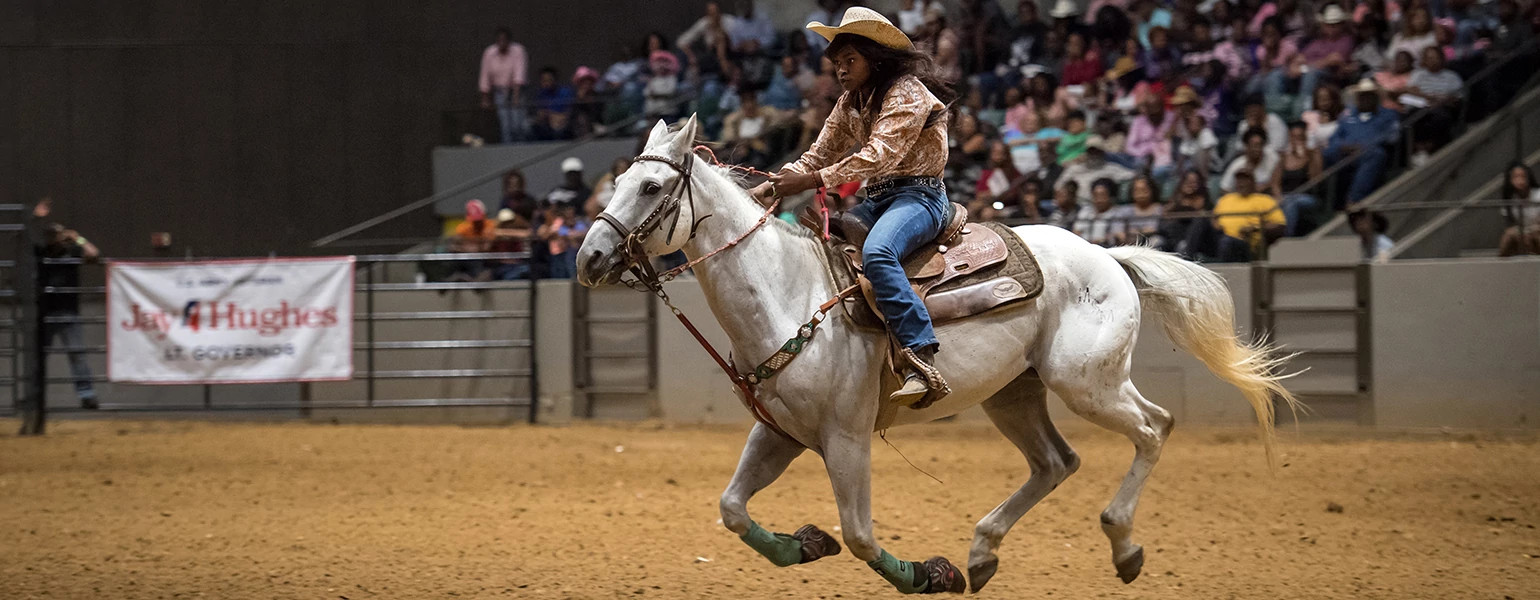 image of black cowgirl on horse by rory doyle