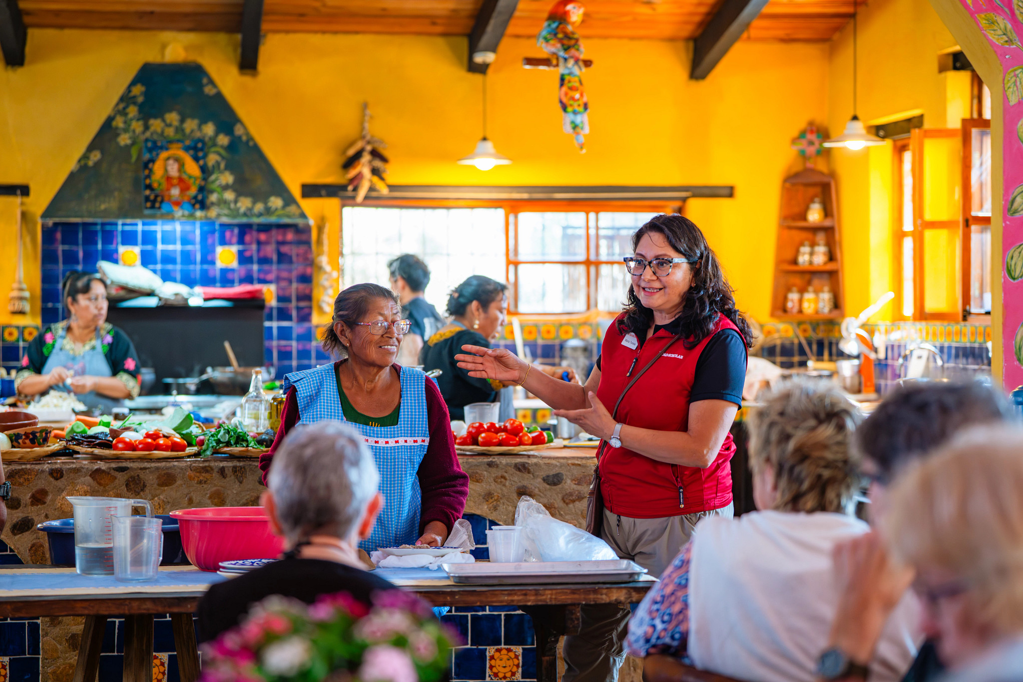 an instructor talking during a cooking class in mexico