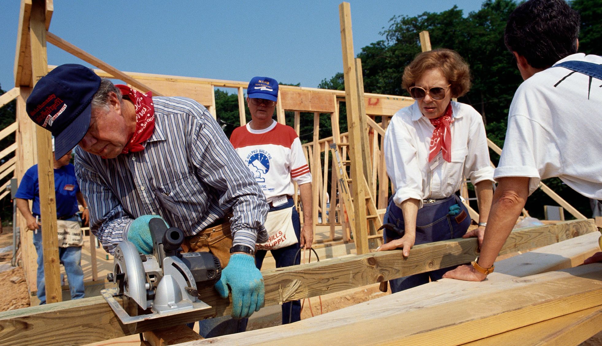 Jimmy Carter, Rosalynn Carter and Habitat for Humanity Jimmy Carter and wife Rosalynn Carter sawing lumber for a house for Habitat for Humanity