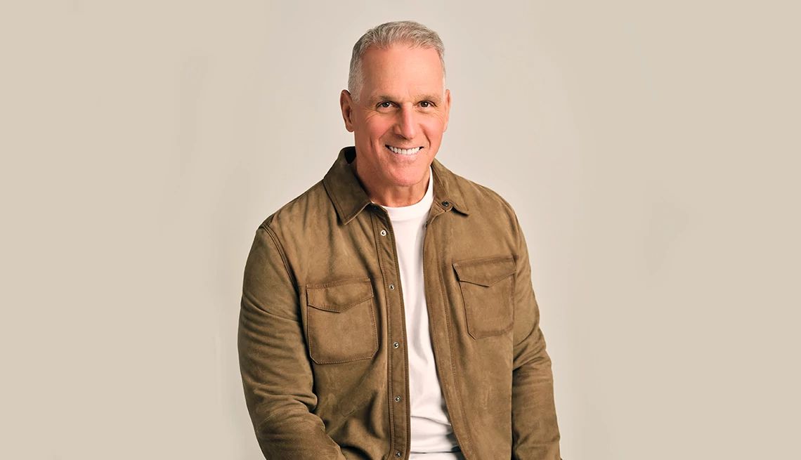 ‘Golden Bachelor’ Apologizes for Ageist Remarks mel owens smiling for a portrait, wearing a brown leather jacket