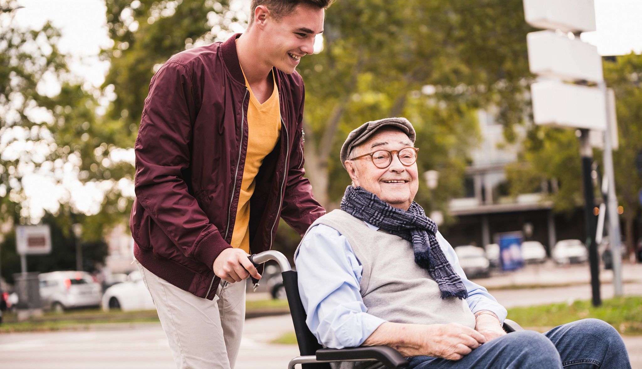Image of a caregiver and elderly man in wheelchair Image of a caregiver and elderly man in wheelchair
