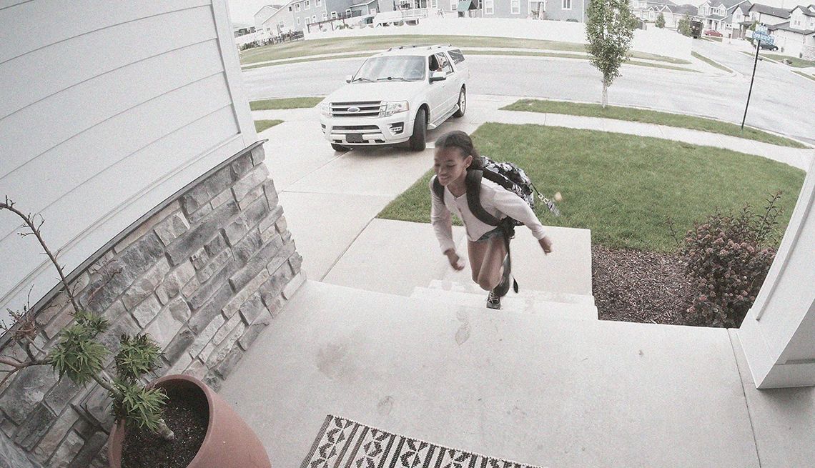 a person approaching a door and is being viewed through a video doorbell