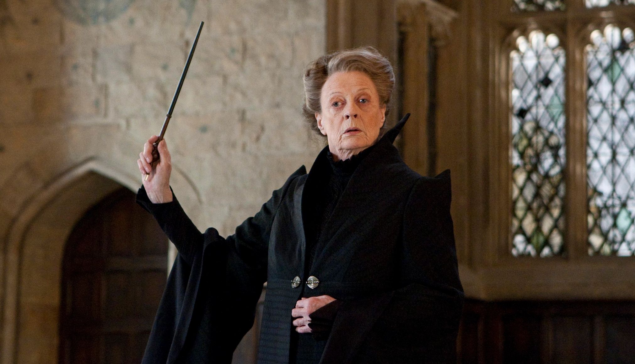 Maggie Smith in Harry Potter and the Deathly Hallows: Part 2 Maggie Smith holding a wand in the film Harry Potter and the Deathly Hallows: Part 2
