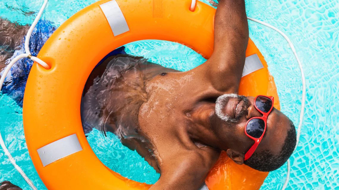 Man floating in the pool