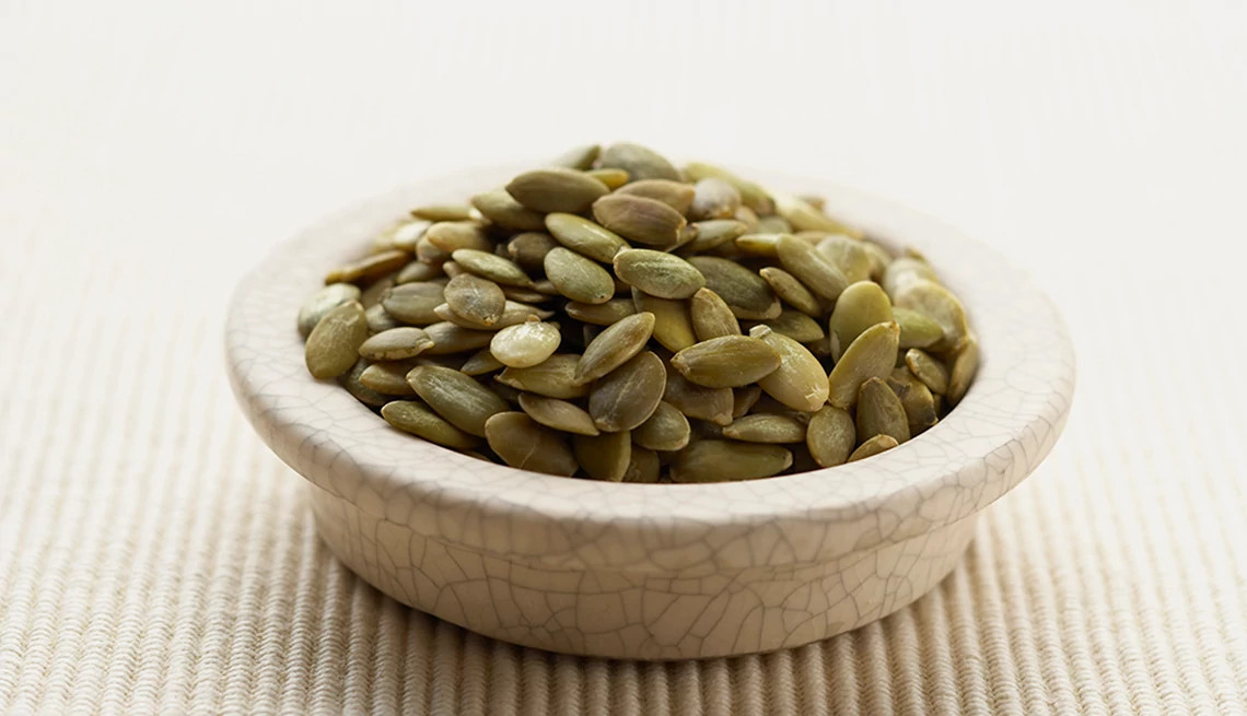 A close-up view of pepita seeds in a bowl