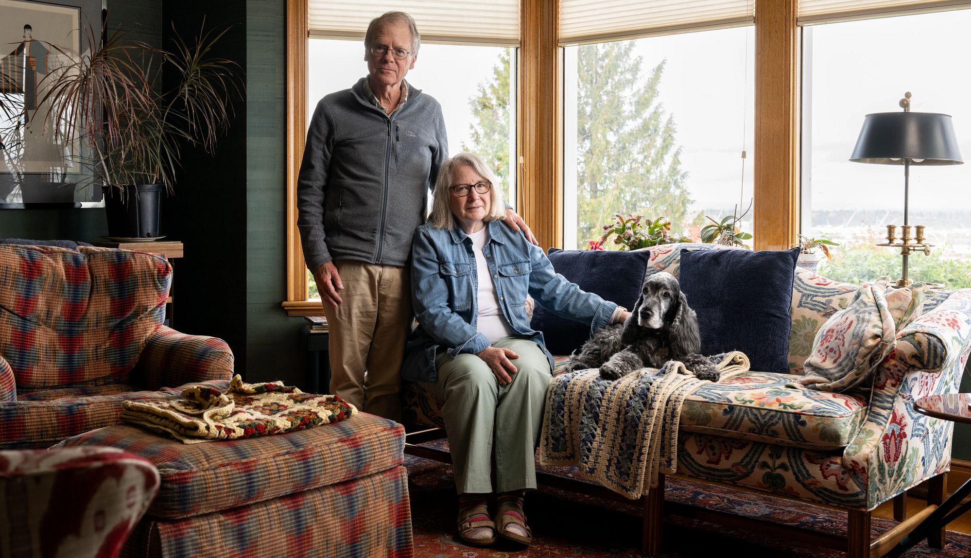 Caregivers Fight to Preserve Dignity and Connection two people with their dog