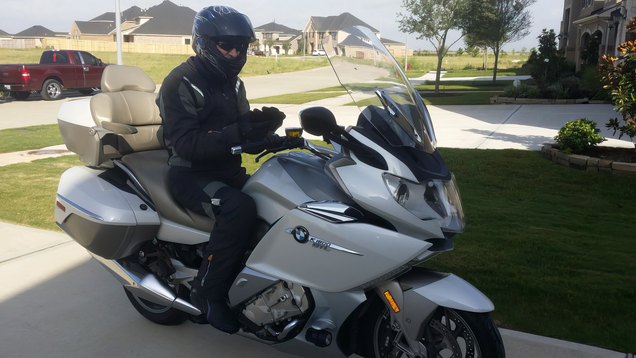 a man sitting on a motorcycle