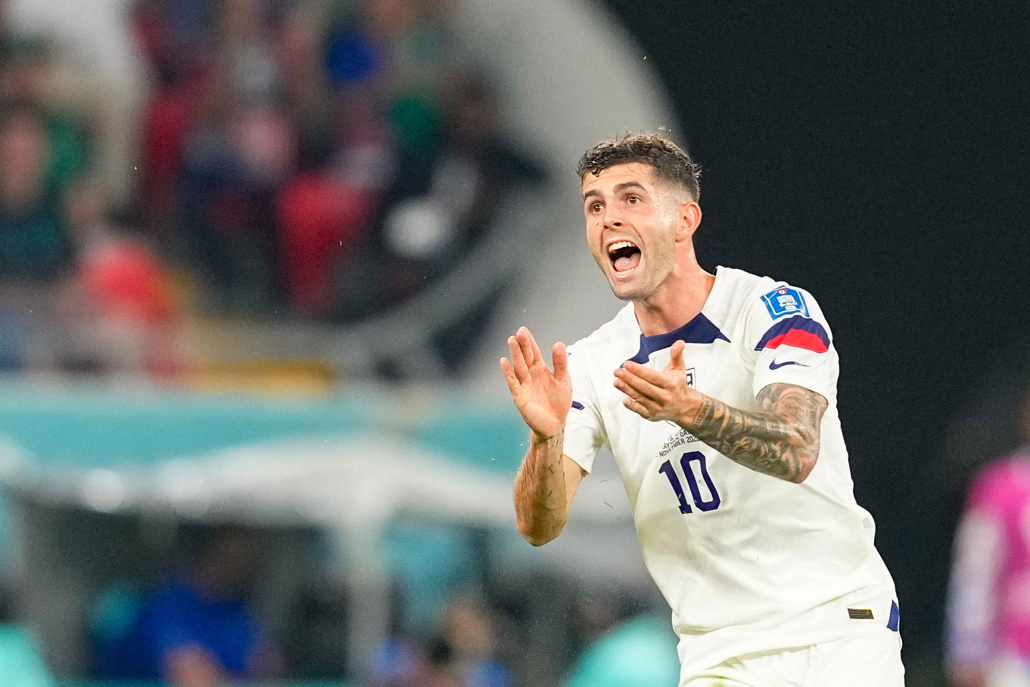 christian pulisic gesturing with his hands during a soccer match