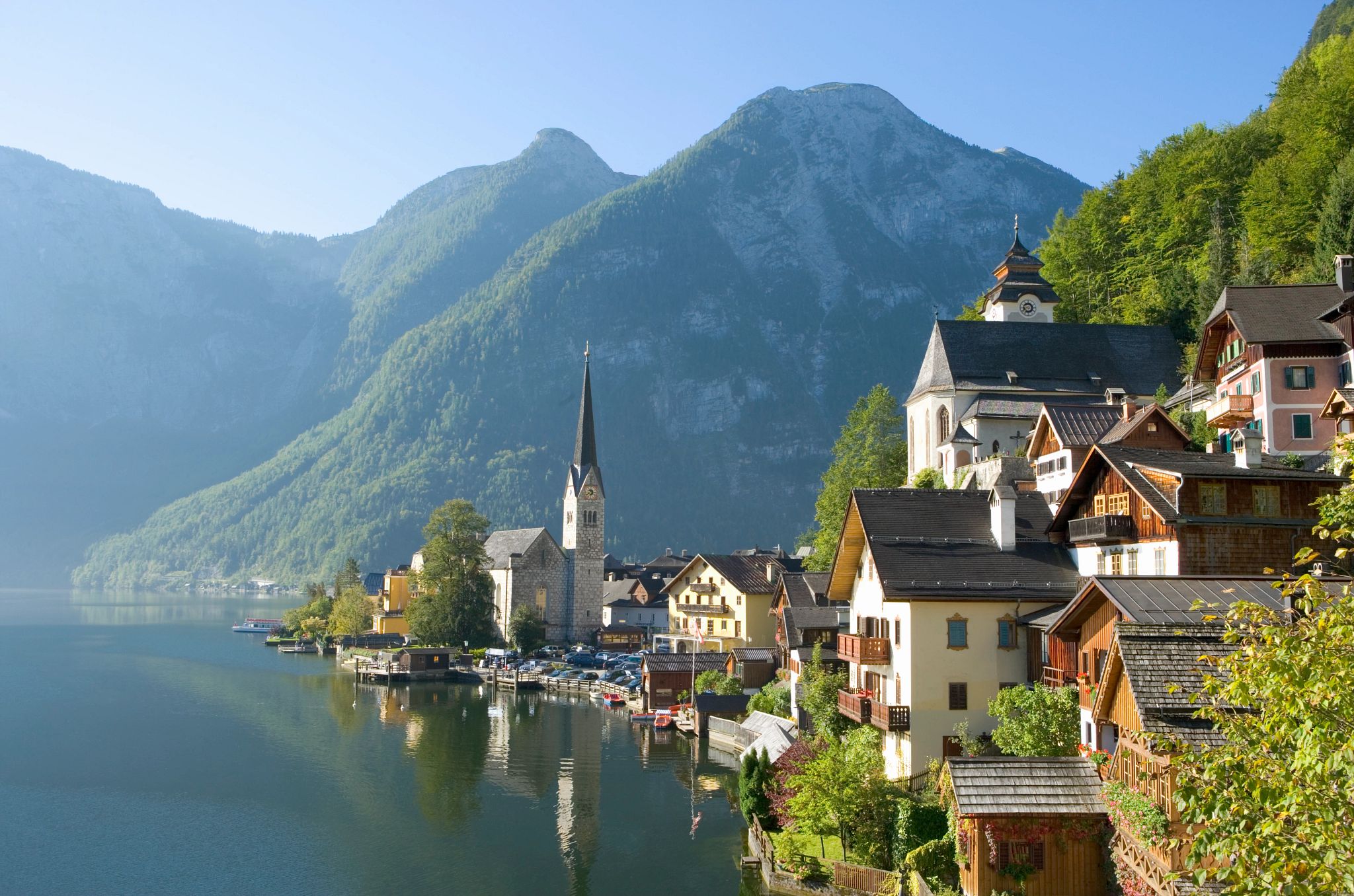 European Storybook Vacations houses and a cathedral near the water in salzburg, austria