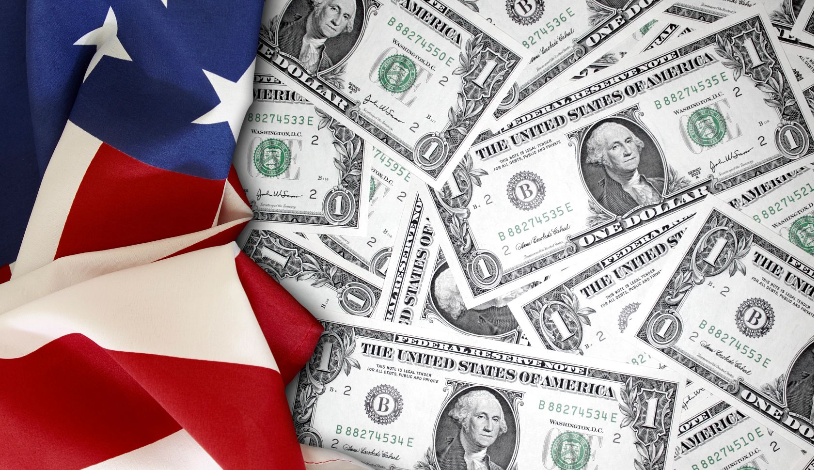 Money on a table with part of an American flag Money on a table with part of an American flag