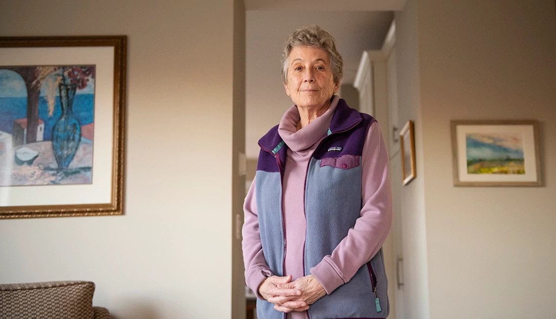 Senior Caucasian woman sits in her home