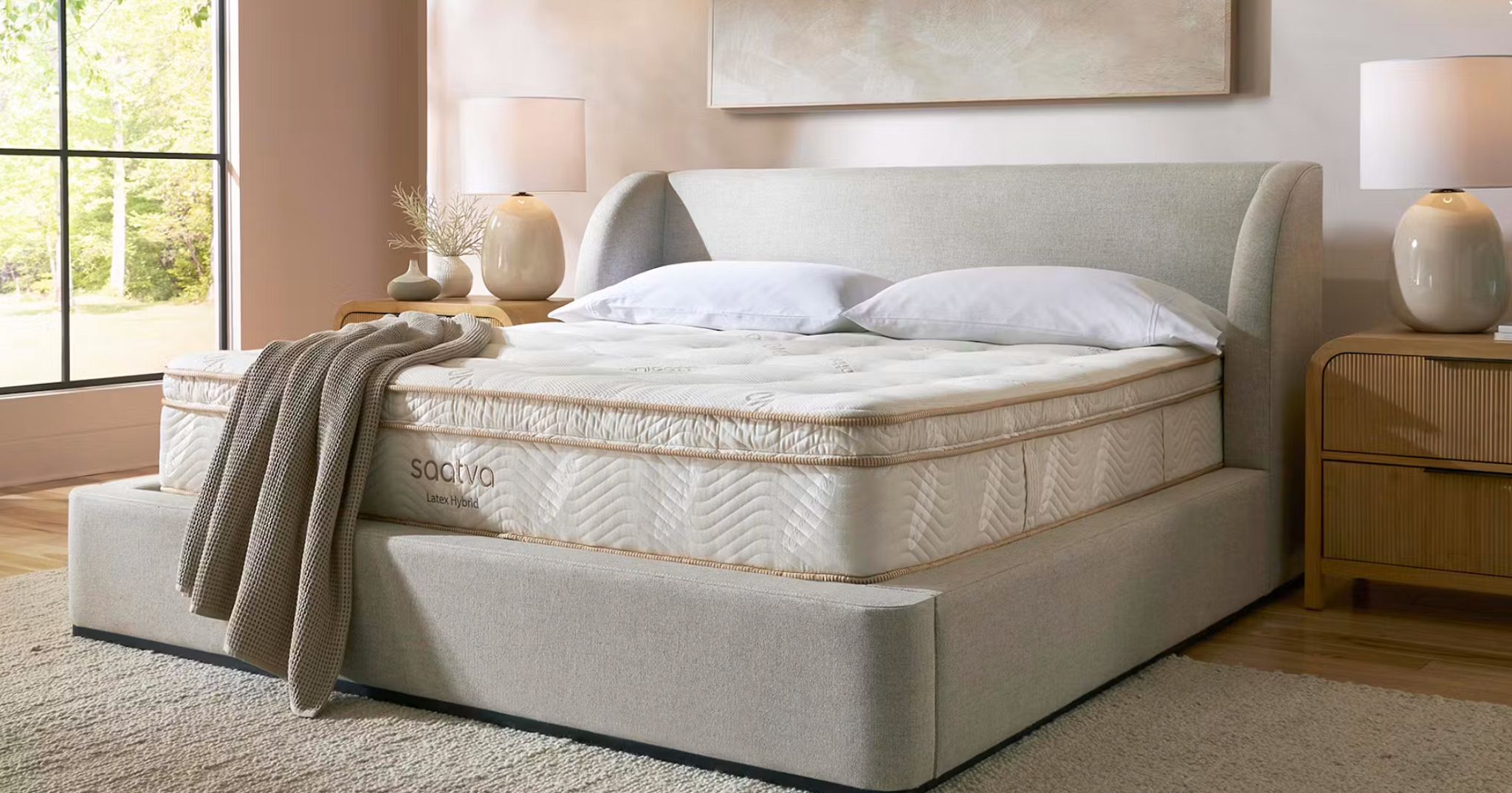 The Saatva Latex Hybrid Mattress displayed in a bedroom
