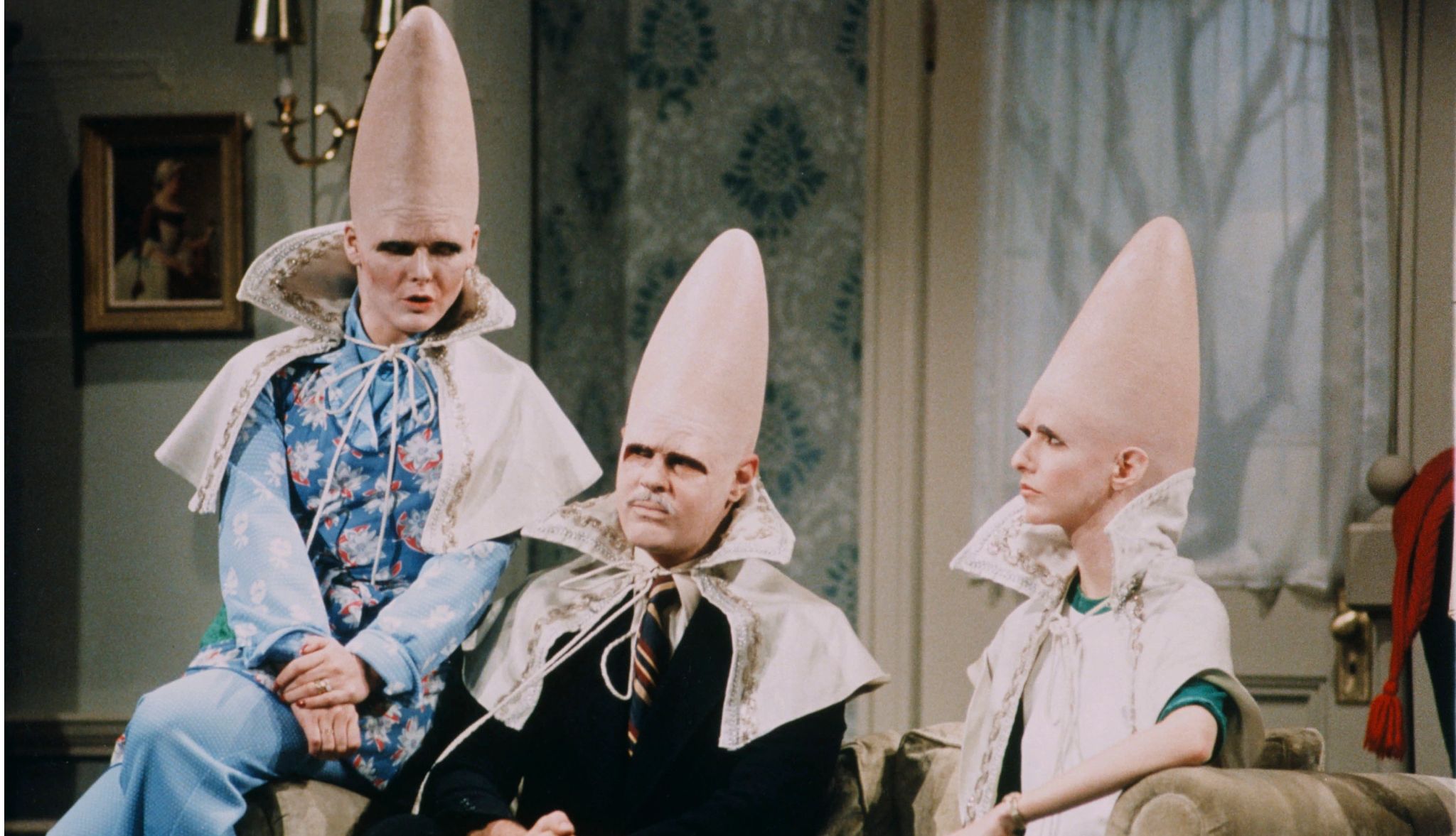 Dan Aykroyd, Jane Curtin and Laraine Newman as 'The Coneheads' on Saturday Night Live Dan Aykroyd, Jane Curtin and Laraine Newman as The Coneheads in a still from Saturday Night Live