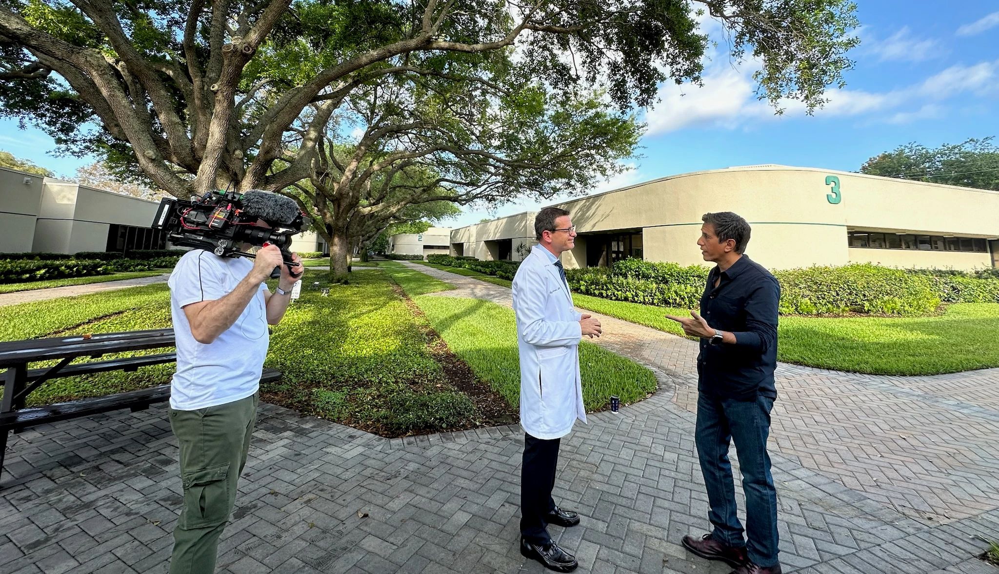 Sanjay Gupta, M.D. interviewing neurologist Richard S. Isaacson Sanjay Gupta, M.D. interviewing neurologist Richard S. Isaacson; person holding video camera recording them