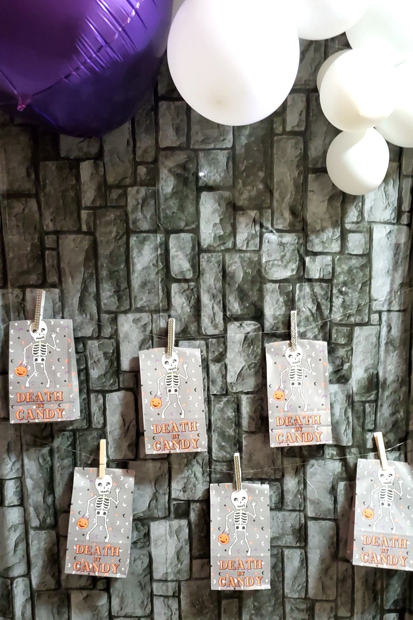 decorative halloween goodie bags hanging on a wall