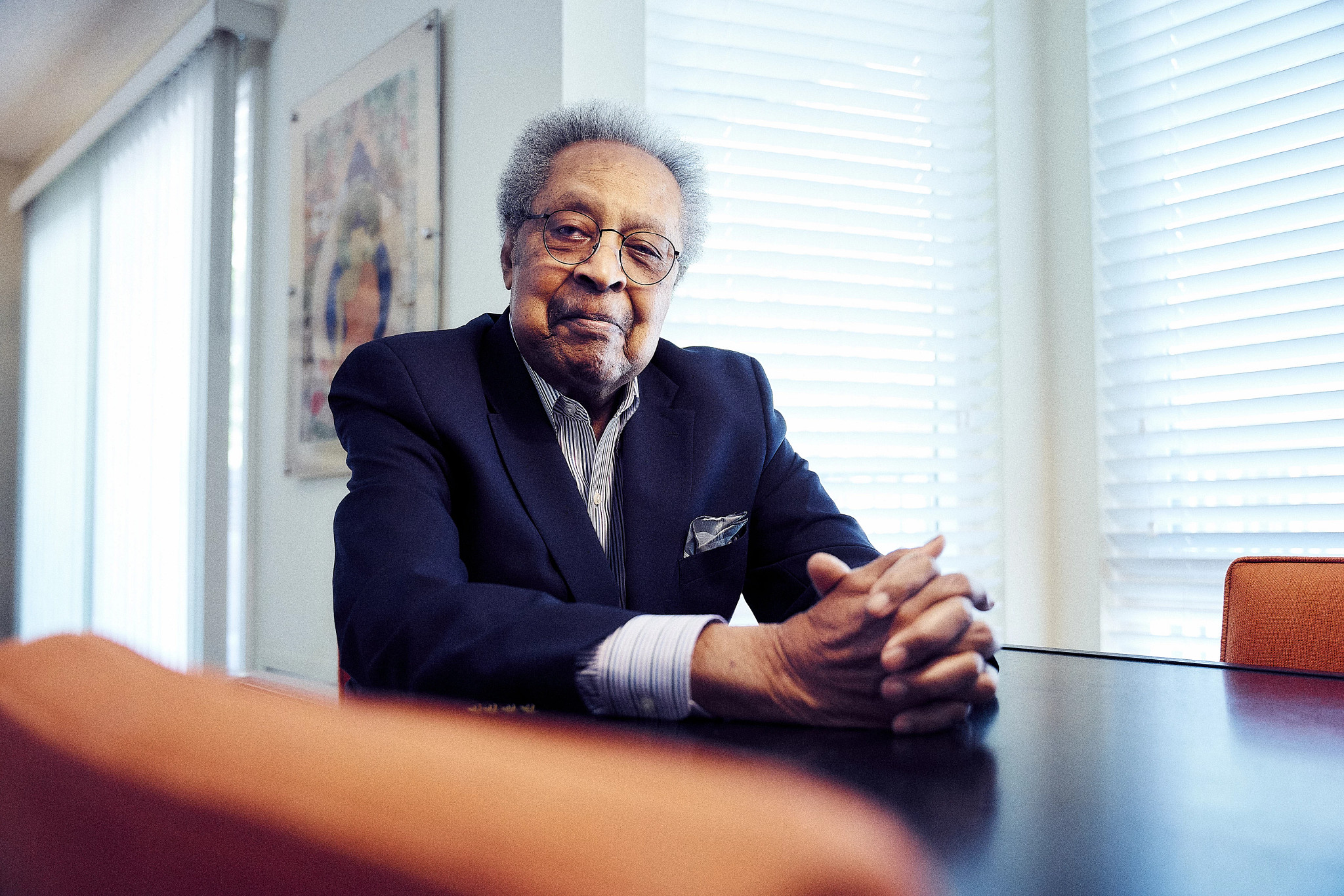portrait of clarence b. jones seated at a desk