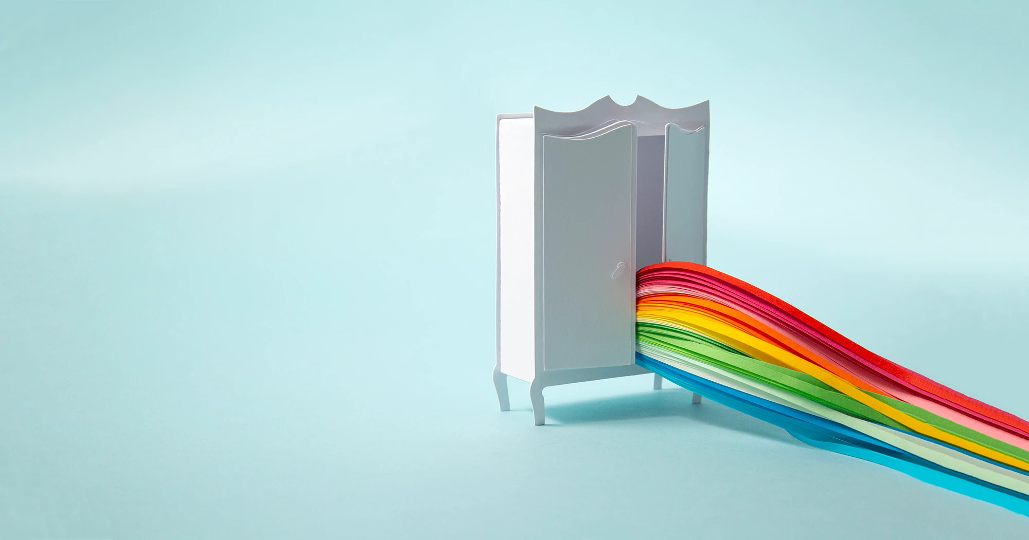 wardrobe with rainbow coming out of it to represent coming out of the closet