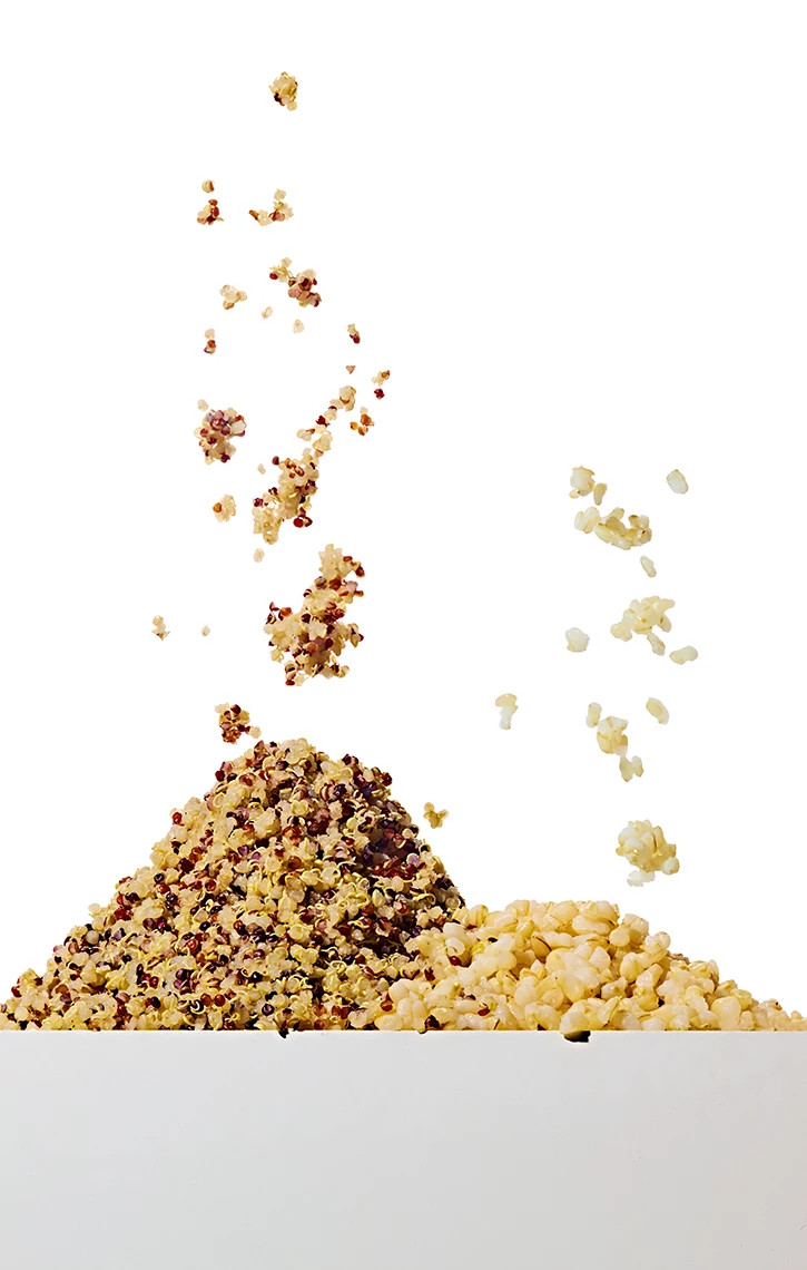 Pile of quinoa next to pile of brown rice