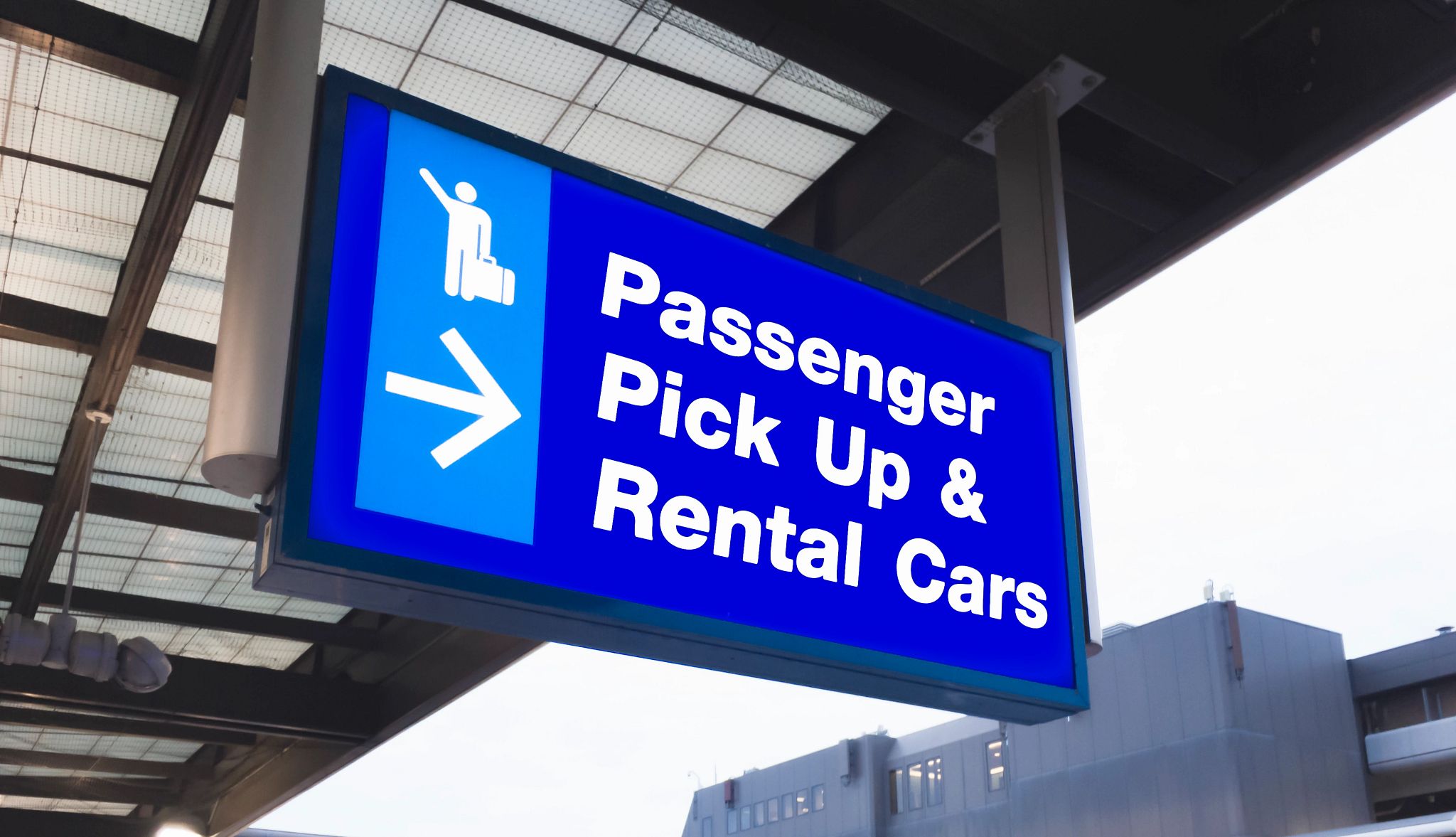 Smart Guide to Car Rentals a blue sign that reads passenger pick up and car rentals