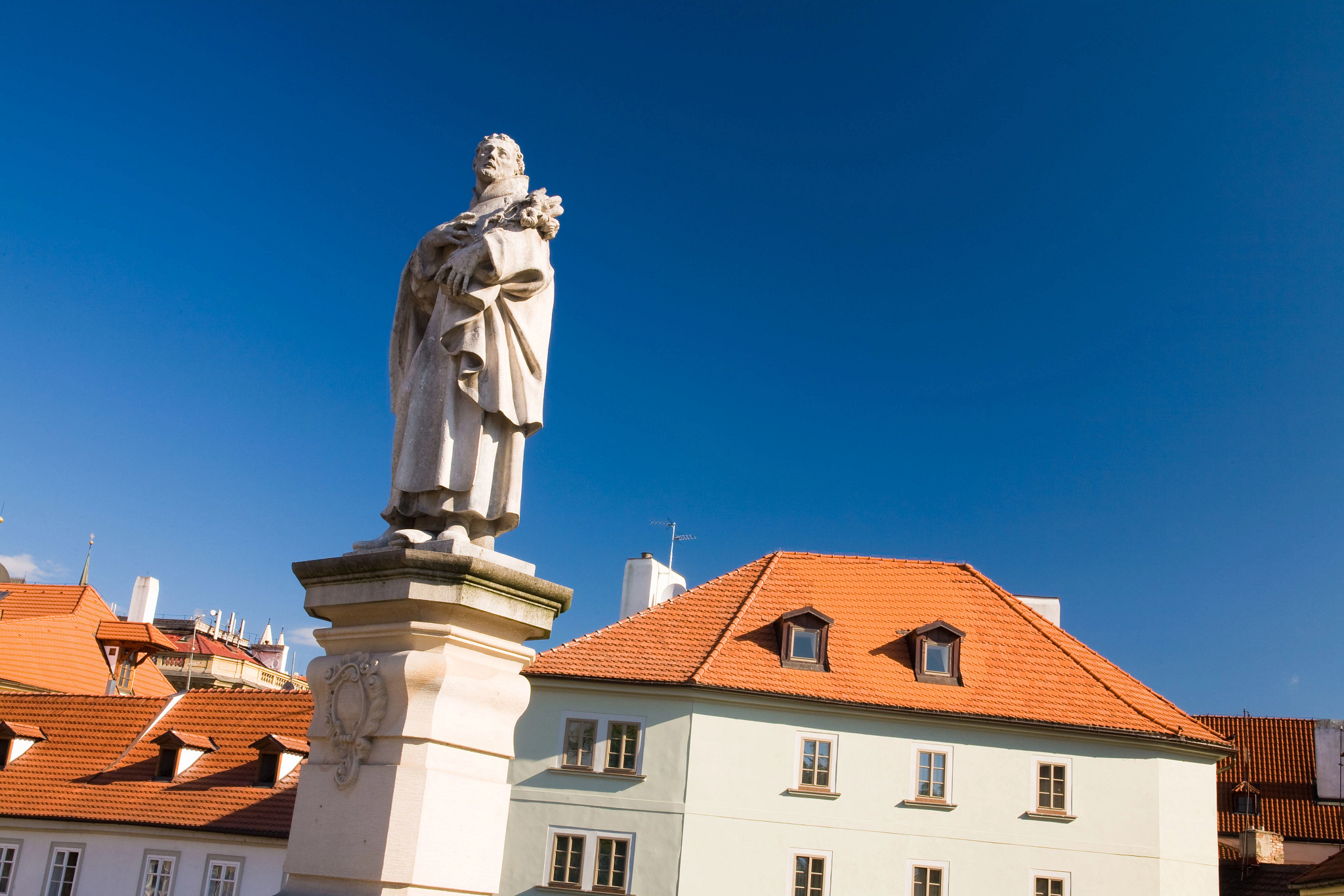 a close-up of a statue on Charles Bridg in Prague