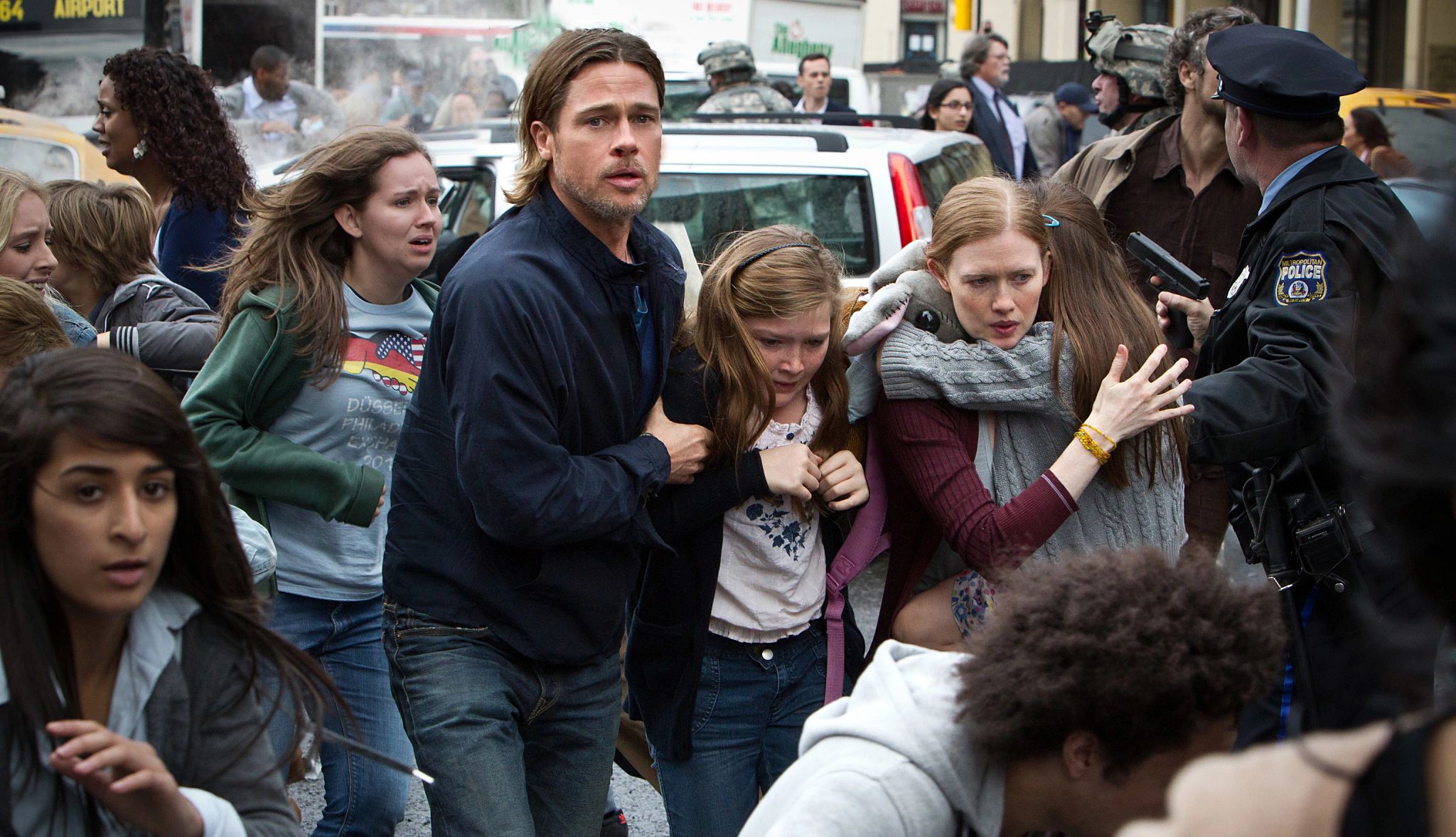 The 12 Best Zombie Movies Ever Brad Pitt, Abigail Hargrove and Mireille Enos in 'World War Z'