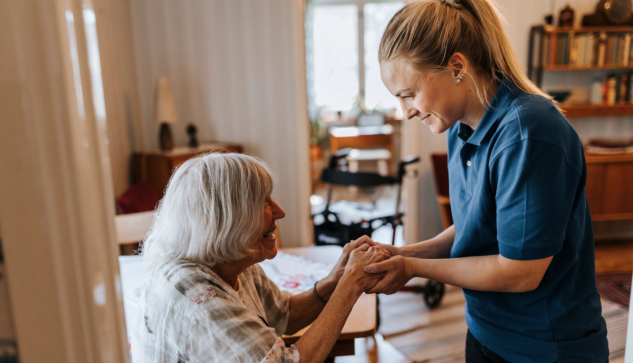 Improve Medicare home health care two women look at each other and hold hands