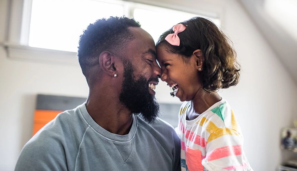Many experts believe your brain reaches a performance plateau in your 30s A man and a young girl laughing with their heads touching