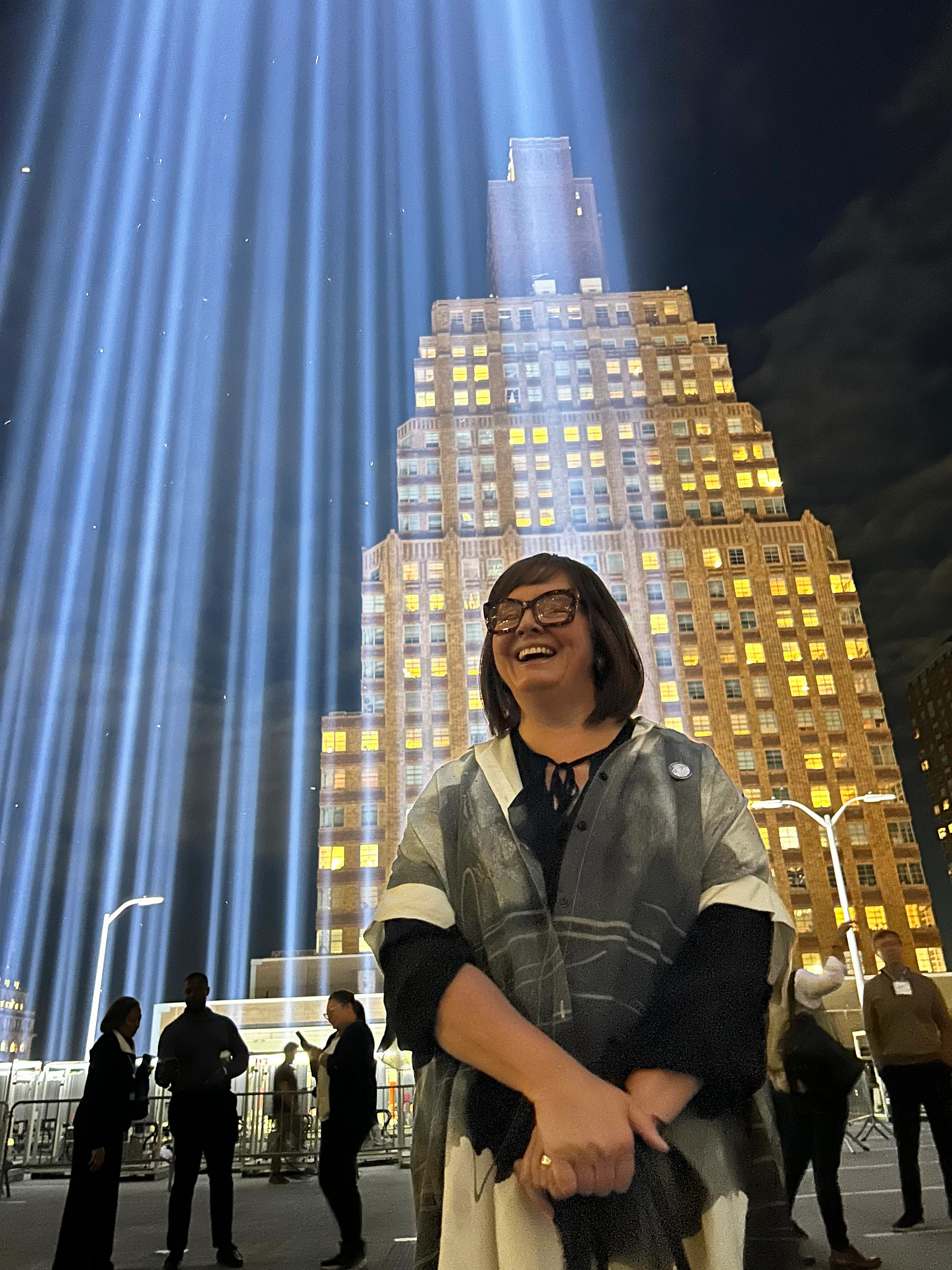 stanton stands beside the twin tower light columns