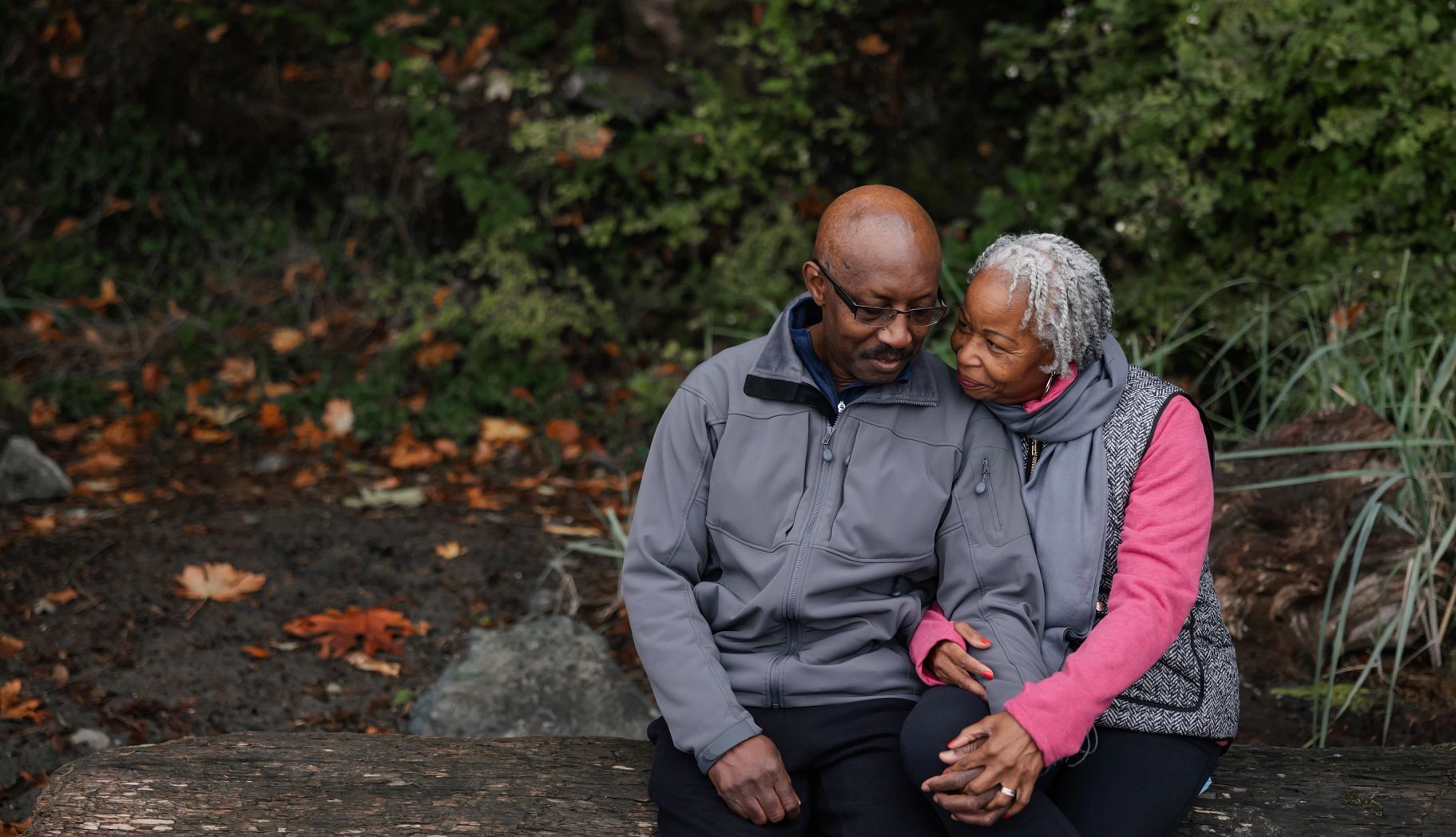 How to talk about your wishes for end-of-life care A man and woman have a conversation while sitting on a bench outside