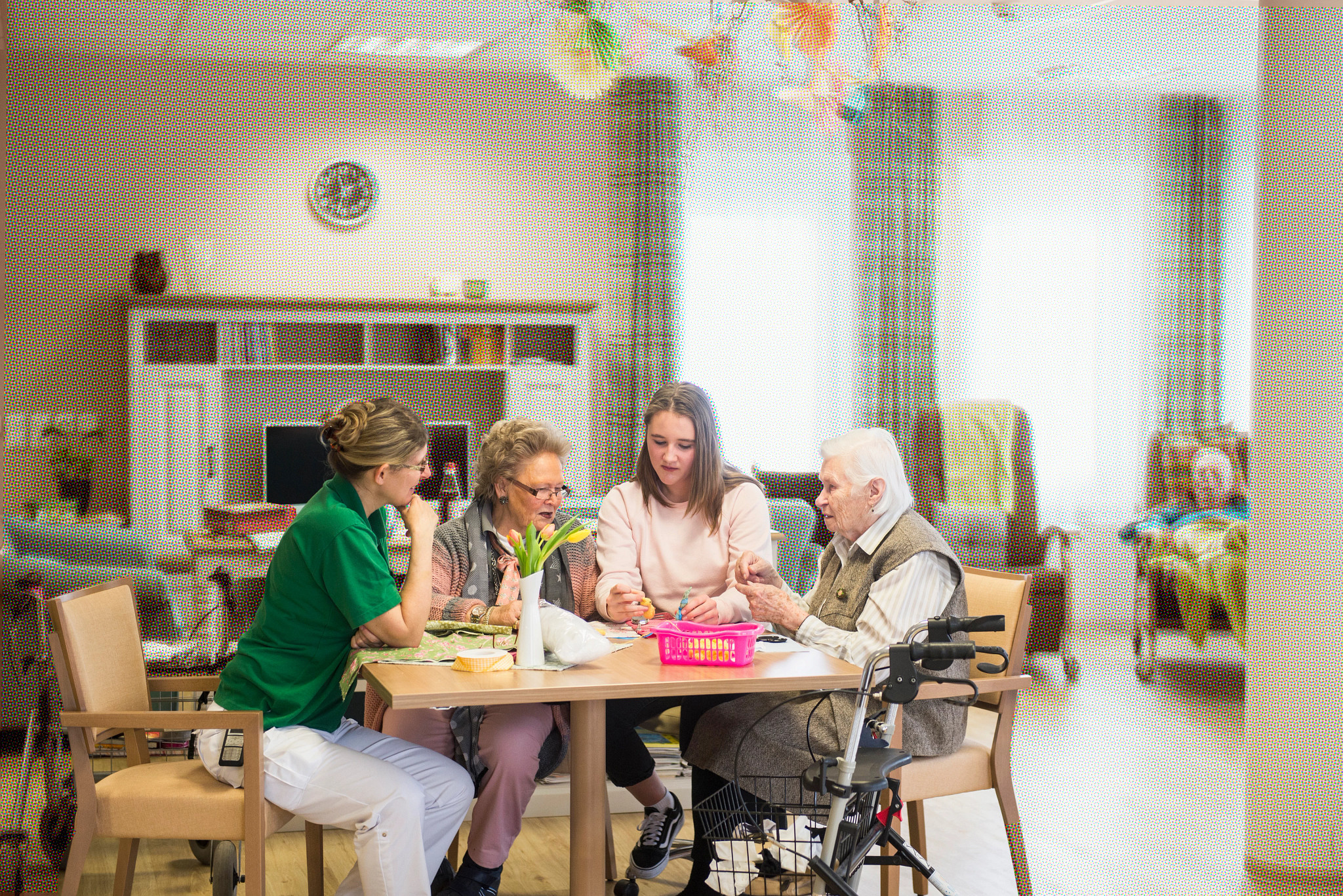 four people sitting around a table