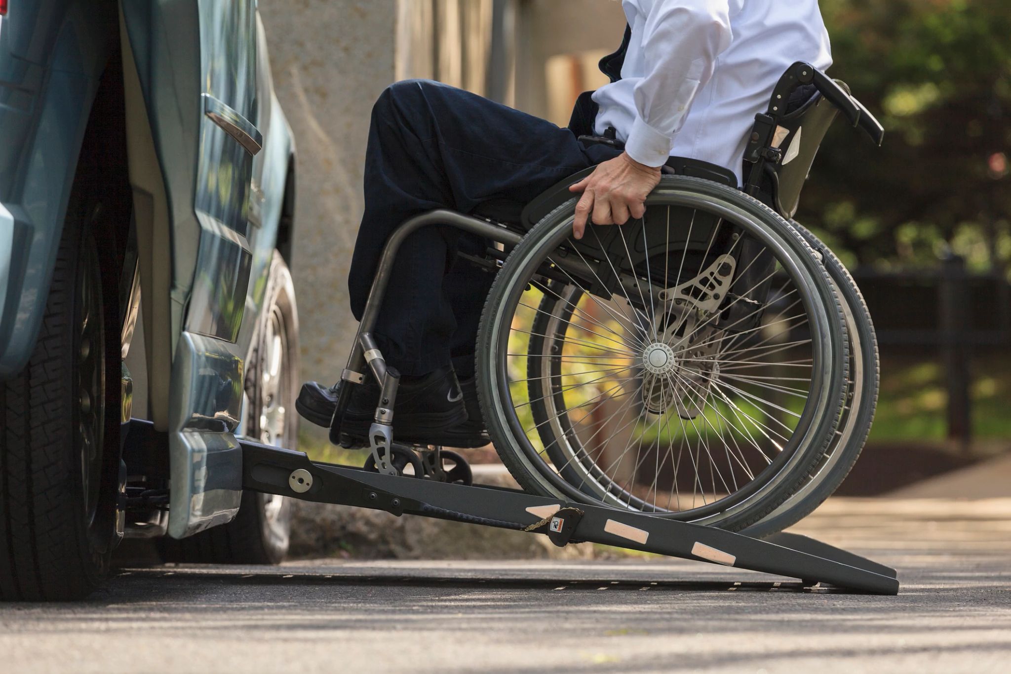 VA can help pay for ramps in your home a person in a wheelchair uses a ramp to get into a vehicle
