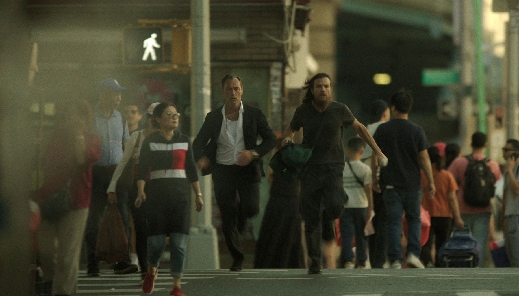 Best Things Coming to Netflix jude law and jason bateman running on a street in a scene from black rabbit