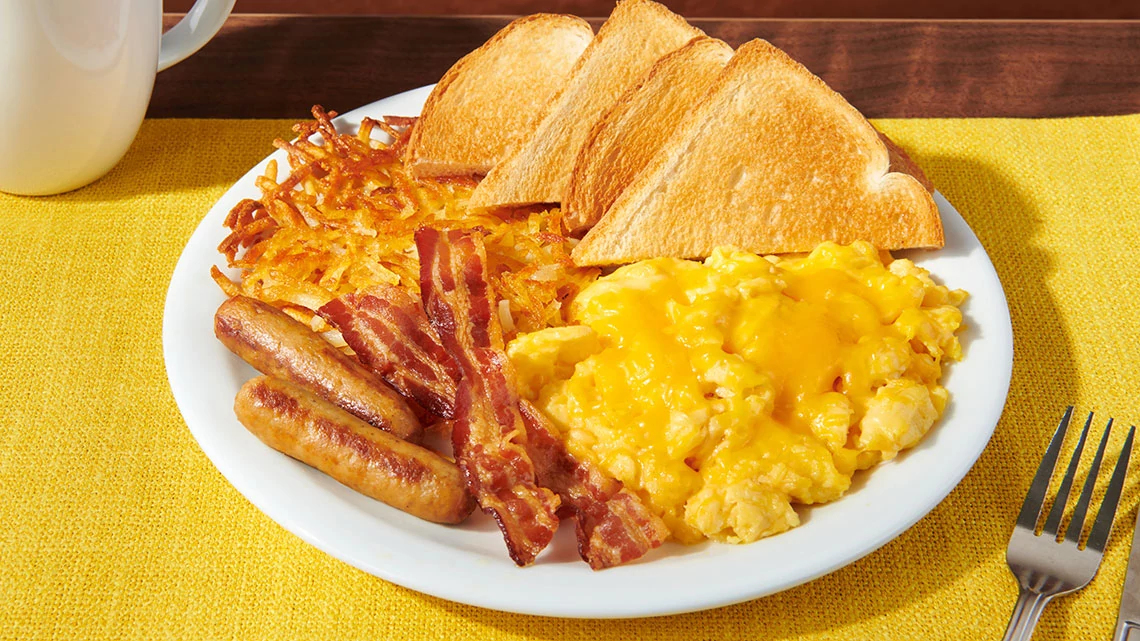 Denny's scrambled eggs, cheddar cheese, bacon strips, sausage links, hash browns, 4 pieces of white bread toast