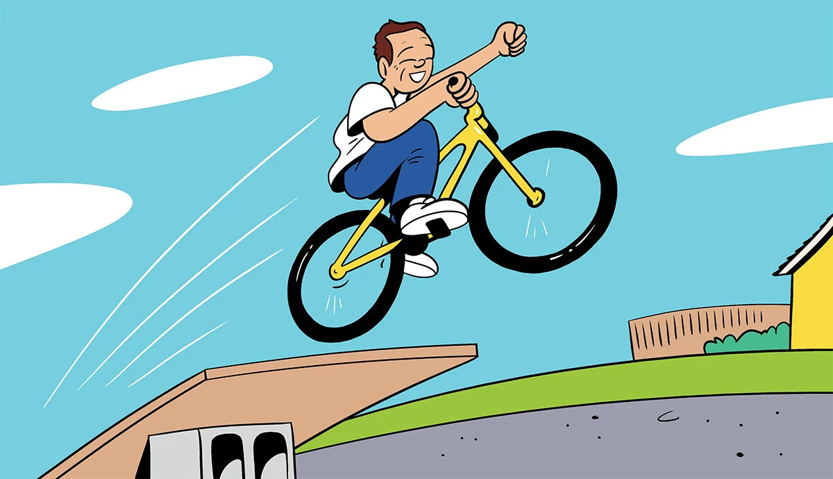 an illustration shows a teen launching his bike off a plywood ramp angled off a cinder block