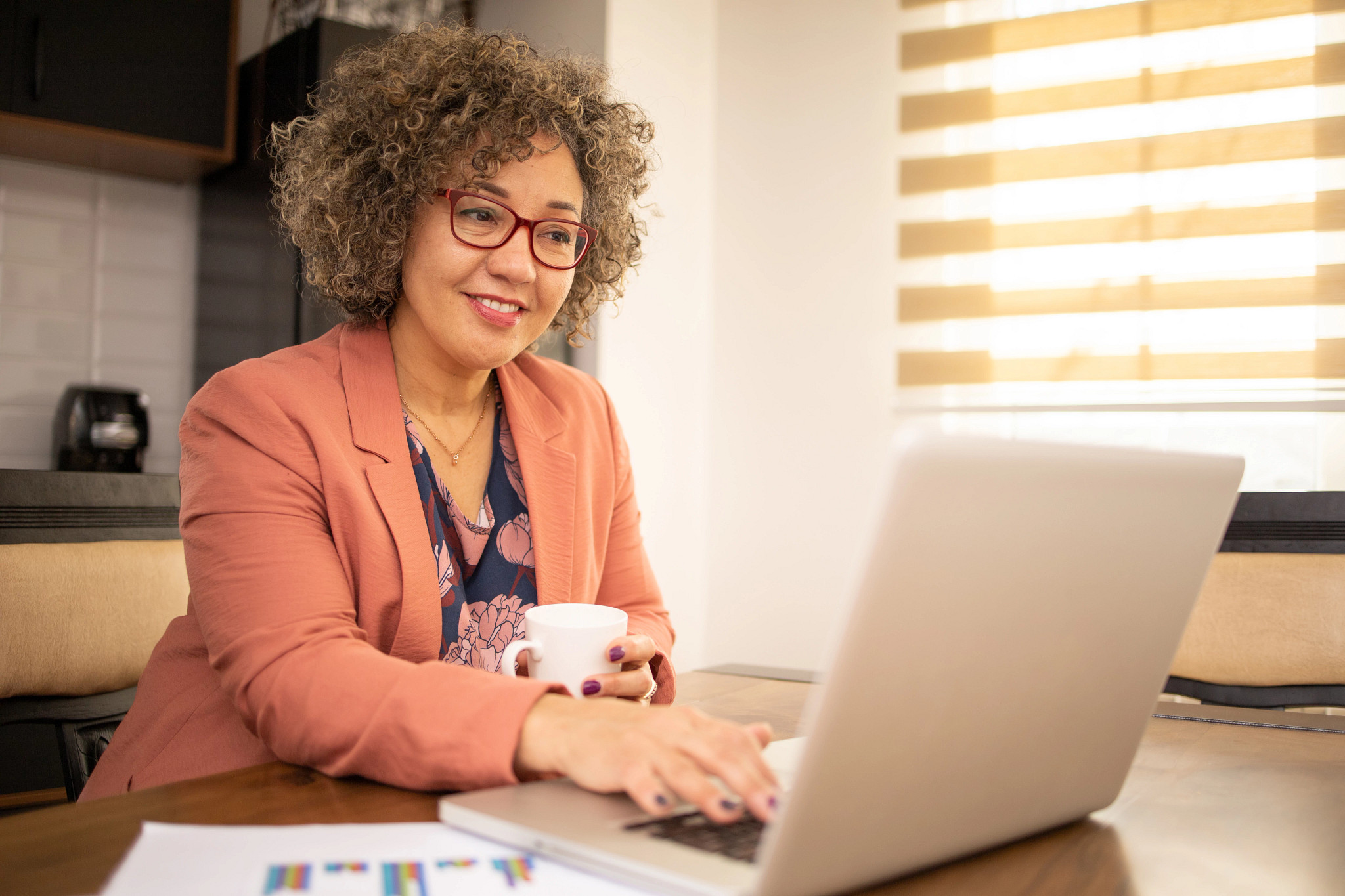 Latina working on a laptop