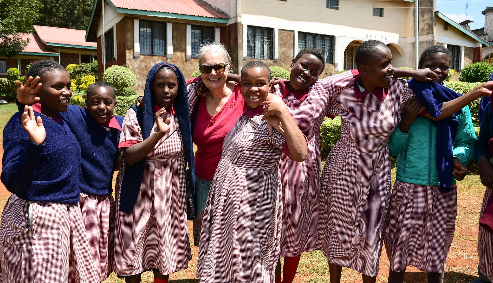 Brenda Birrell makes reusable kits Brenda Birrell with girls from the Karatina Special School