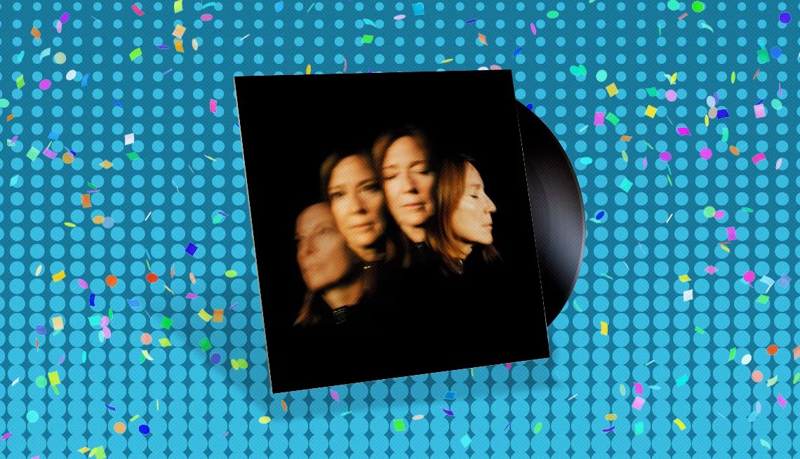 Beth Gibbons' “Lives Outgrown” Album cover with record sticking out of it and four images of same person going from blurry to less blurry on cover; blue background with confetti on it