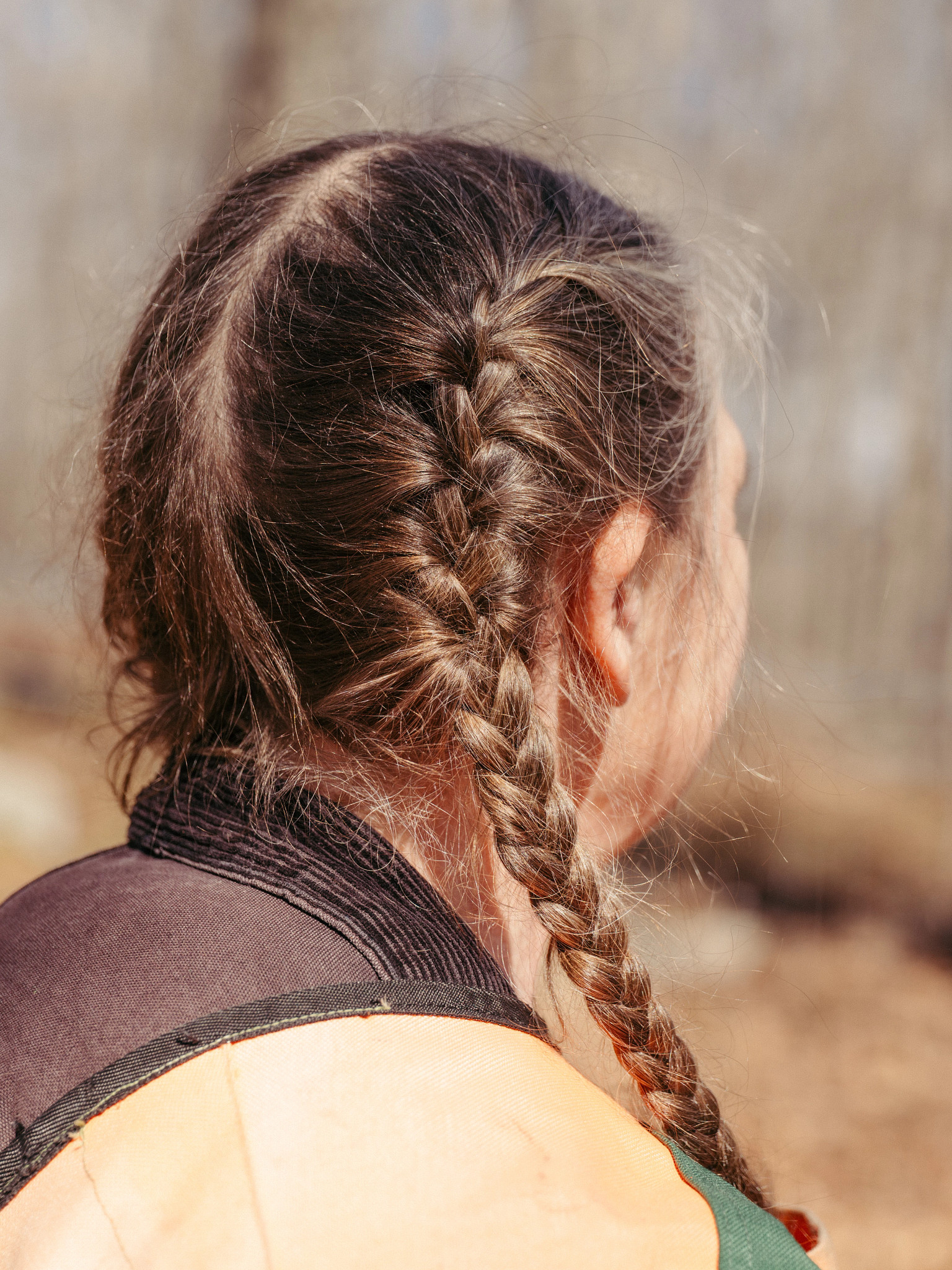 Close-up of neatly braided hair on an adult person