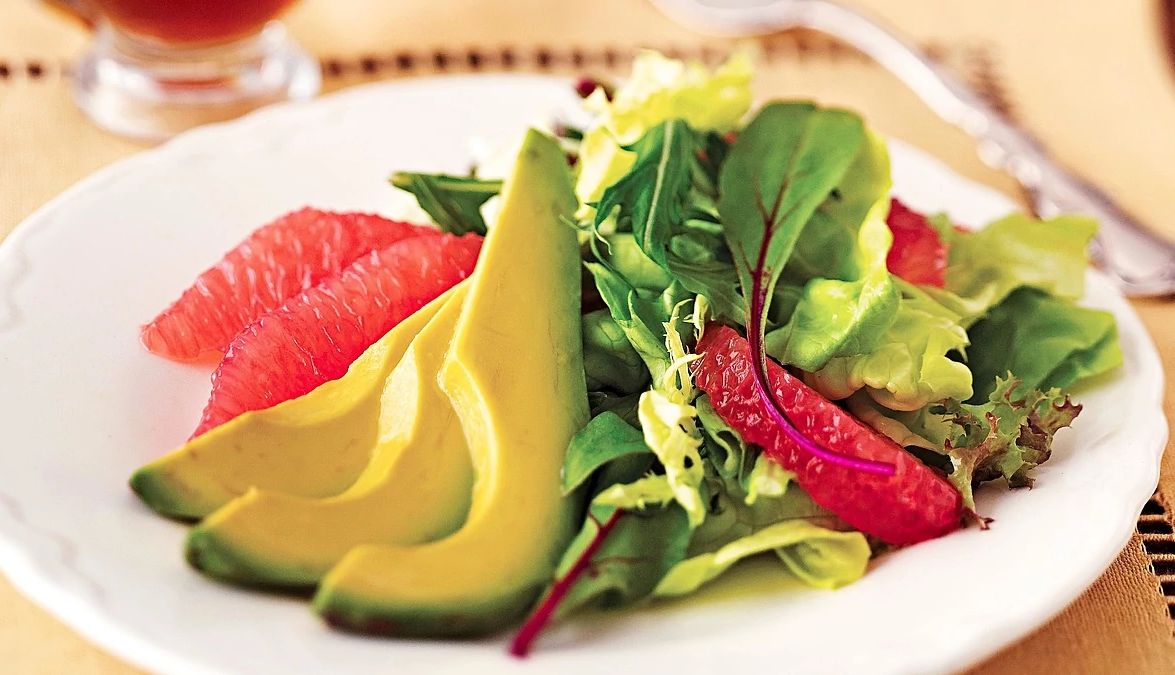 Avocado and grapefruit salad A close-up view of avocado and grapefruit salad on a plate