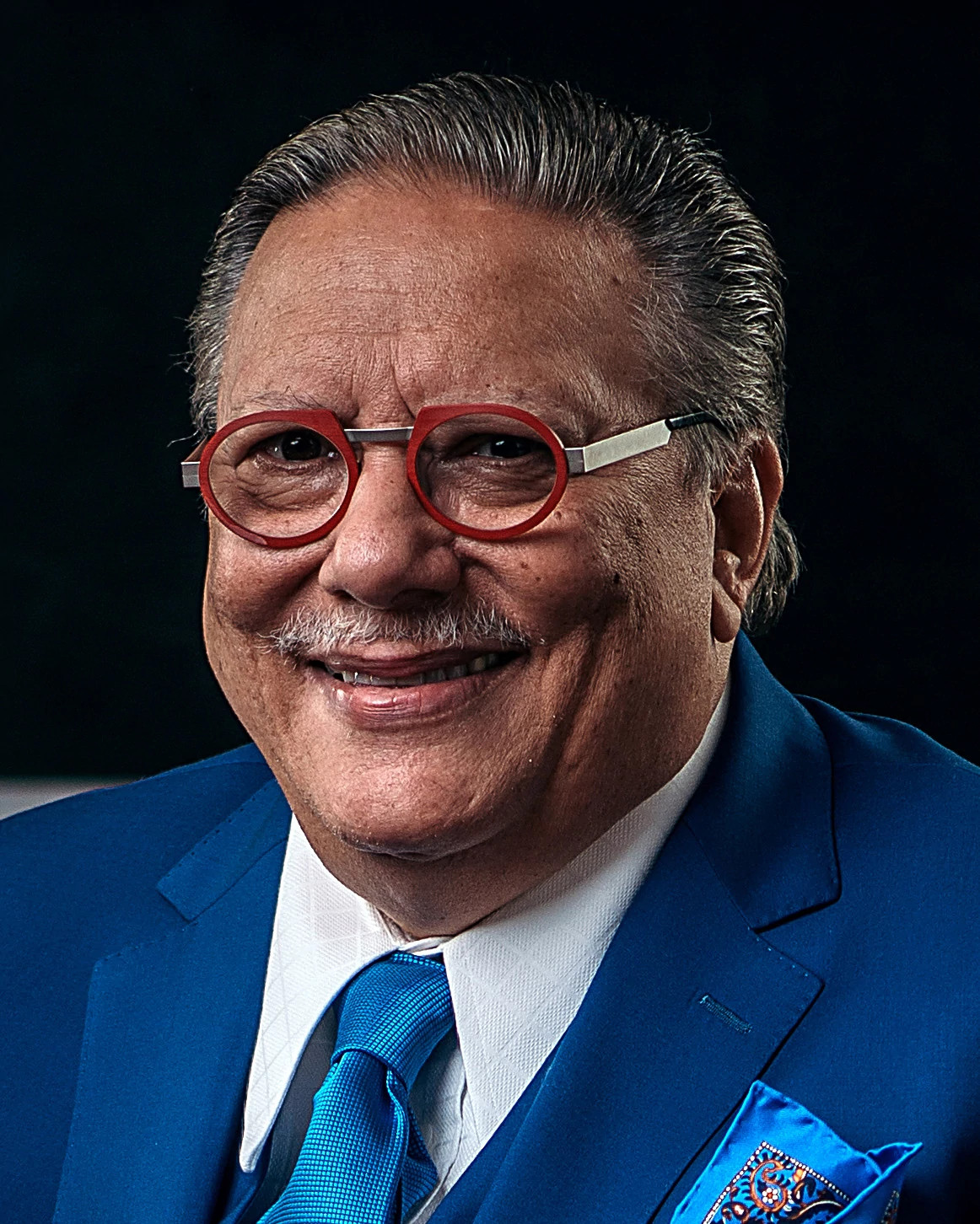 Jazz artist Arturo Sandoval smiling for a portrait