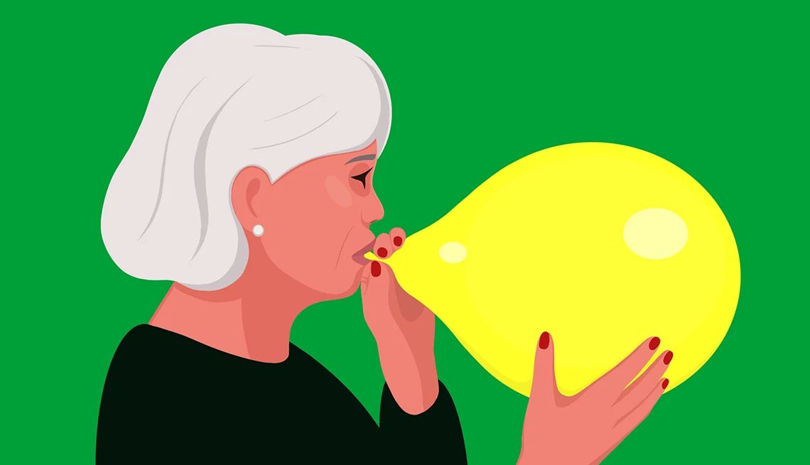 My Husband Can Only Get an Erection with Oral Sex a woman is blowing up a yellow ballon