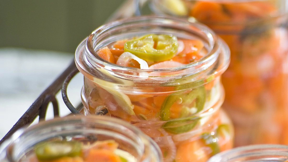 A close-up view of Mexican pickled carrots in a jar