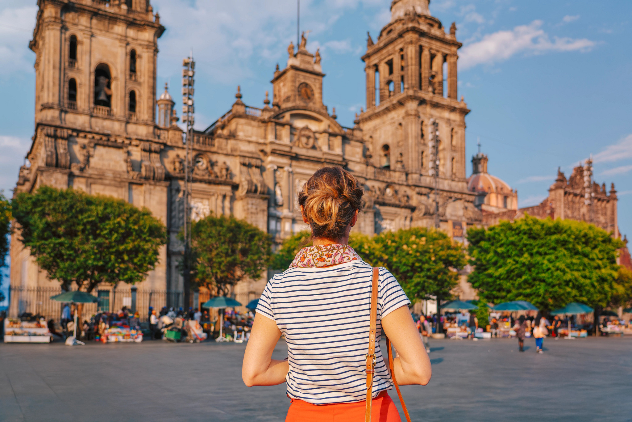 a woman looking at the Mexico City Metropolitan Cathedral