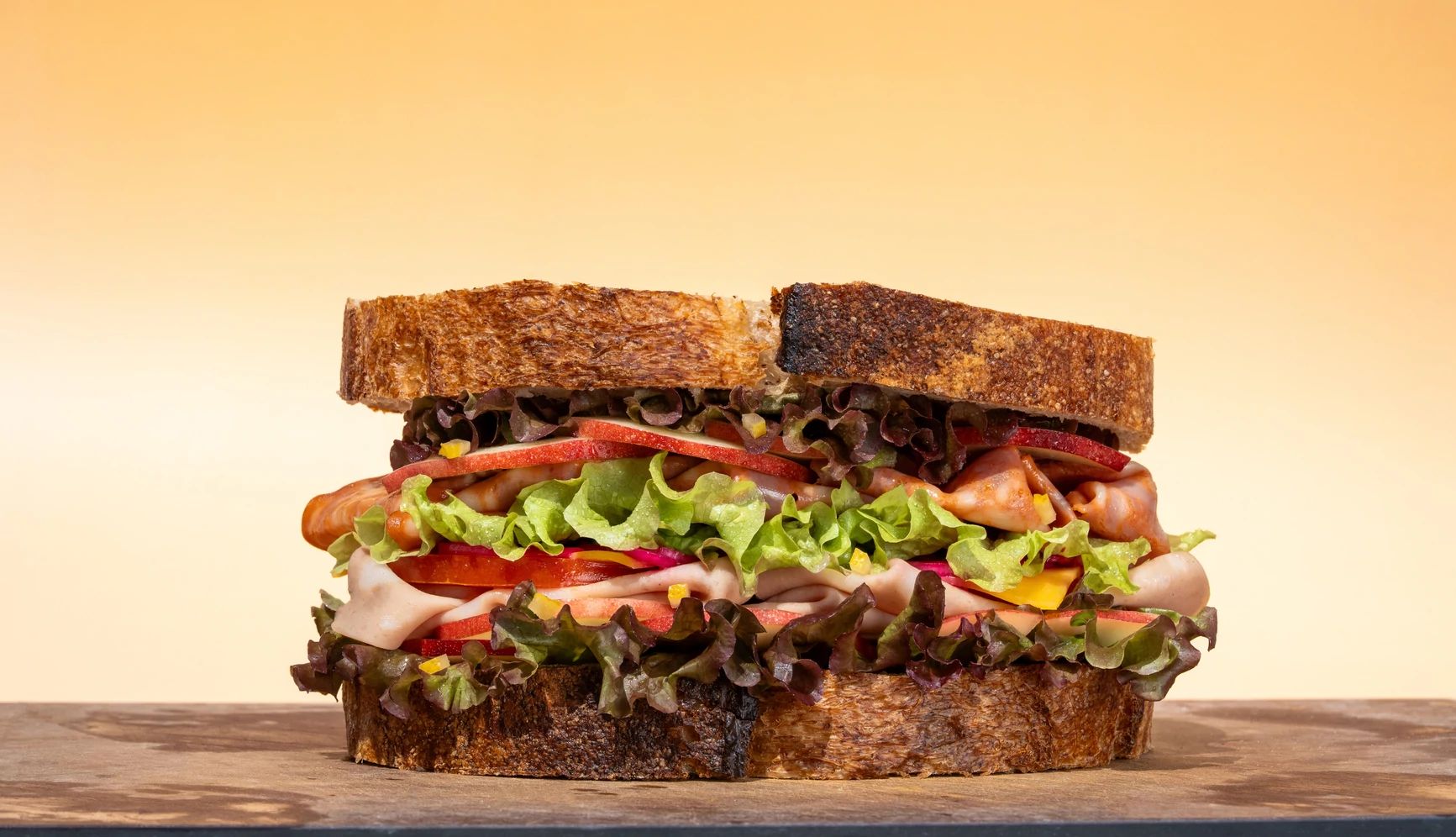 Sandwich Day Deals  a photo shows a sandwich on a cutting board