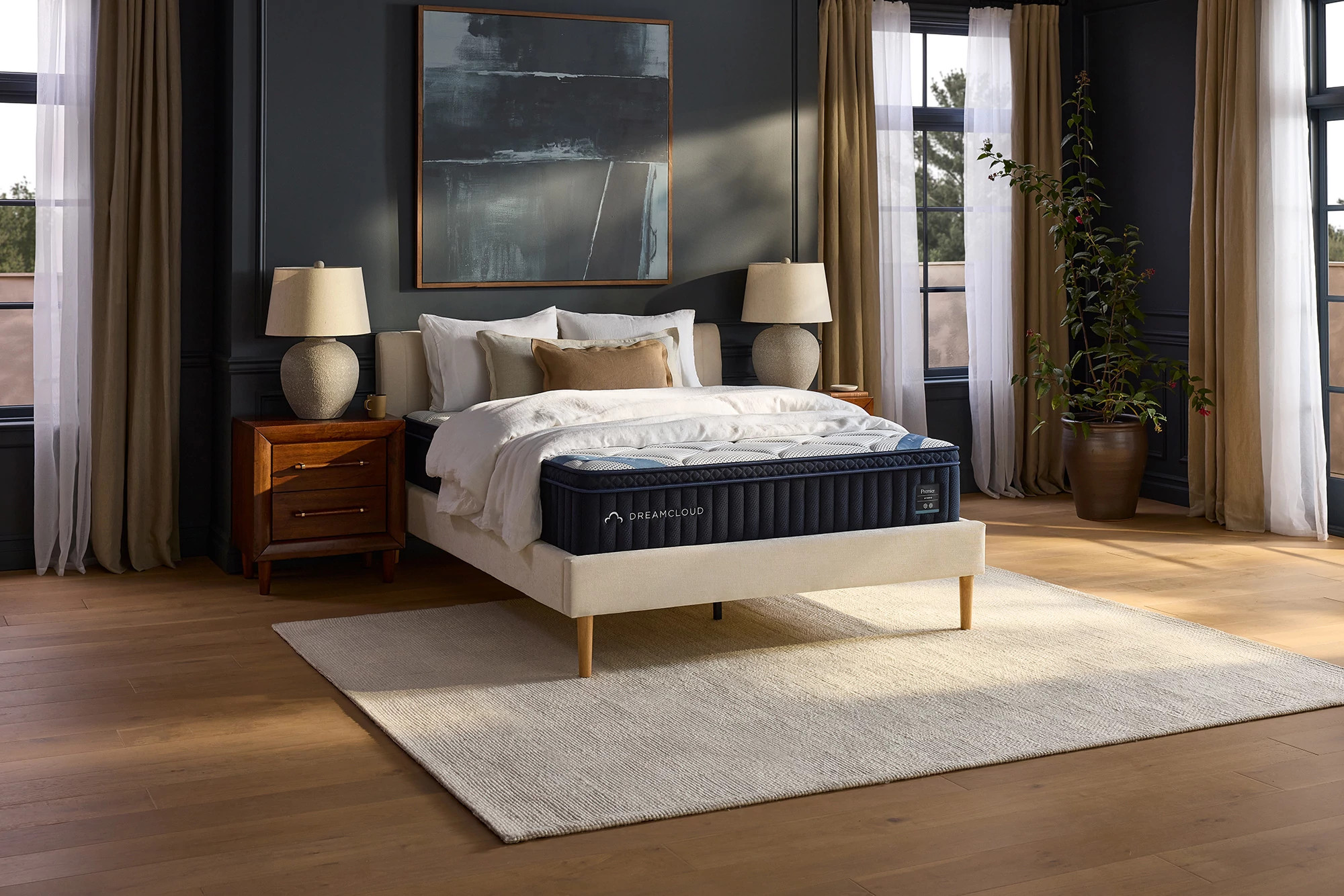 The DreamCloud Premier mattress in a blue bedroom.