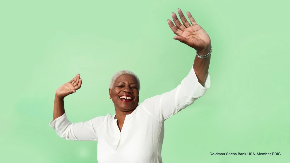 Smiling African American woman dancing