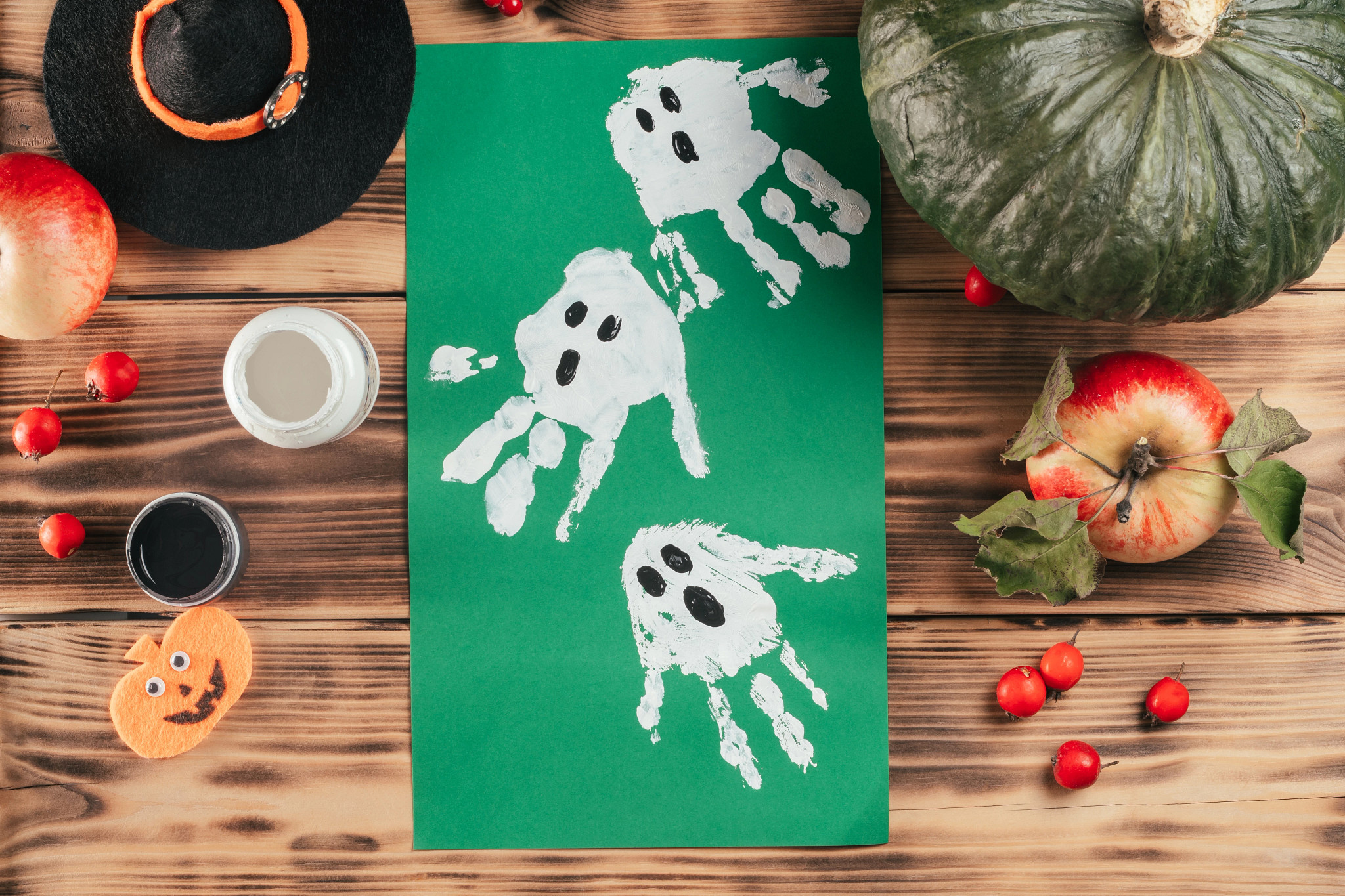 Ghost garlands seen from an overhead view on a wood table