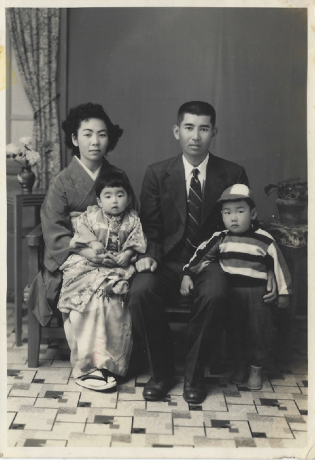 This photo led him to connect with his relatives a black and white photo of Jon Arakaki's relatives