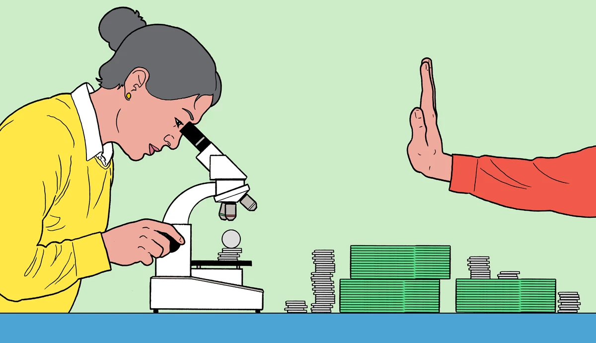 a person looking at money under a microscope