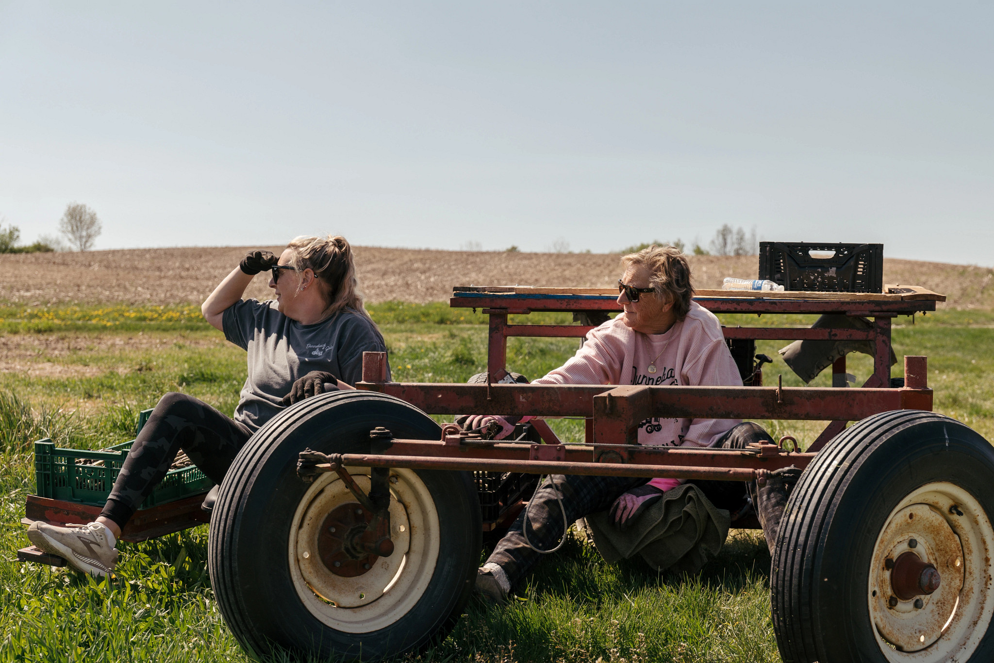 a photo shows Stephanie Ginsberg and Suanne Shoemaker working on the farm